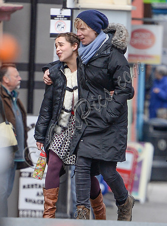Emilia Clarke embraced by Thea Sharrockarrival on set.
