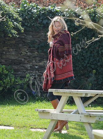 Kate Moss wears patterned blanket wrap at Cotswold pub