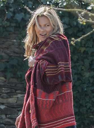Kate Moss wears patterned blanket wrap at Cotswold pub