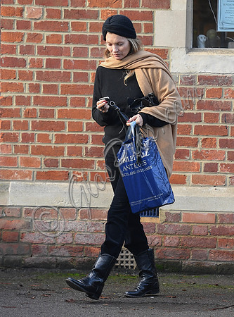Kate Moss black turban hat and camel scarf