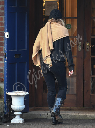 Kate Moss black turban hat and camel scarf