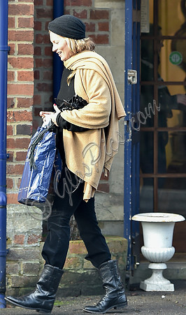 Kate Moss black turban hat and camel scarf
