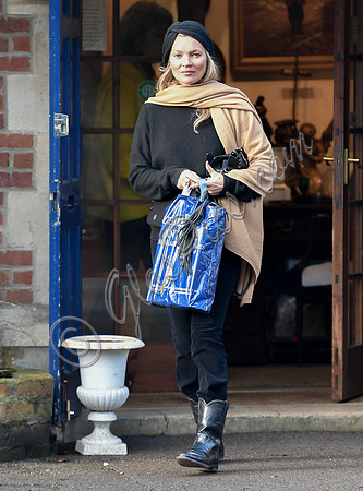 Kate Moss black turban hat and camel scarf