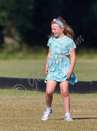 Mia Tindall wearing turquoise sun dress