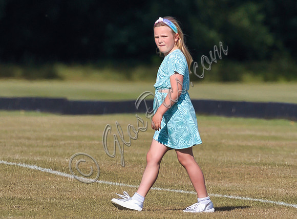 Mia Tindall wearing turquoise sun dress