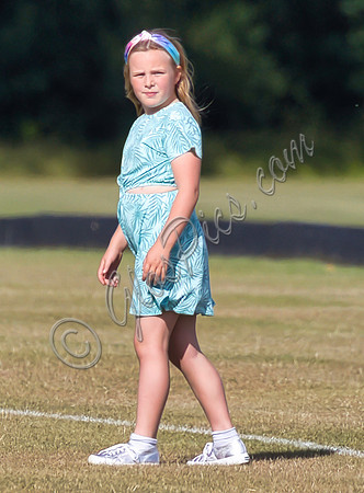 Mia Tindall wearing turquoise sun dress
