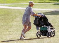 Zara Tindall pushing baby buggy