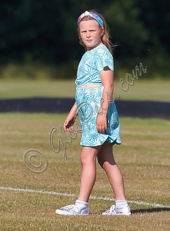 Mia Tindall wearing turquoise sun dress