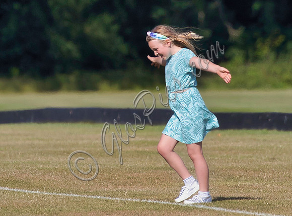 Mia Tindall wearing turquoise sun dress