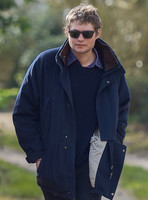 Nikolai von Bismarck wearing navy peacoat and sunglasses