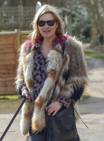 Kate Moss wearing Isabel Marant fur jacket and suede ankle boots with her dog Archie