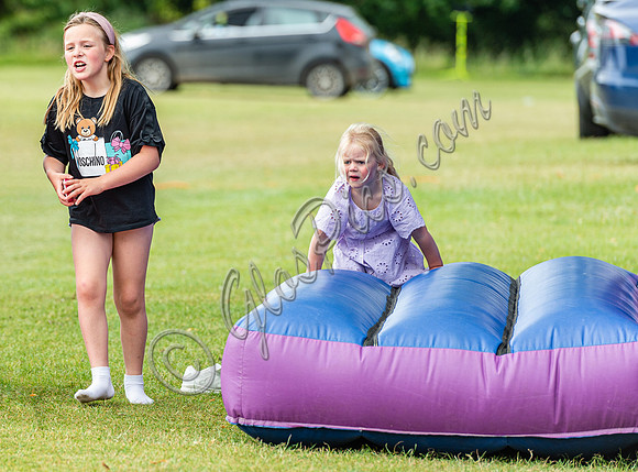 Mia and Lena Tindall​​​​​​​ playing on bouncy castle