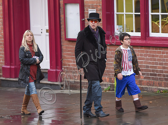 Nicolas Cage morphs Dickens and Willy Wonka shopping with Kal-El and housekeeper.