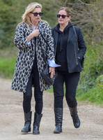 Kate Moss wearing Gucci mohair animal print overcoat with one other female