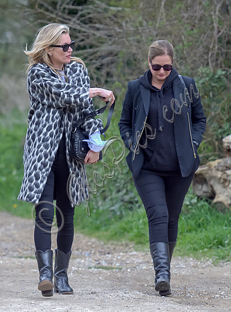 Kate Moss wearing Gucci mohair animal print overcoat with one other female