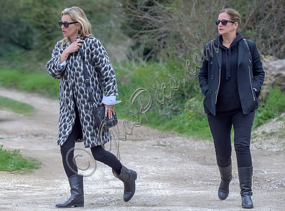 Kate Moss wearing Gucci mohair animal print overcoat with one other female