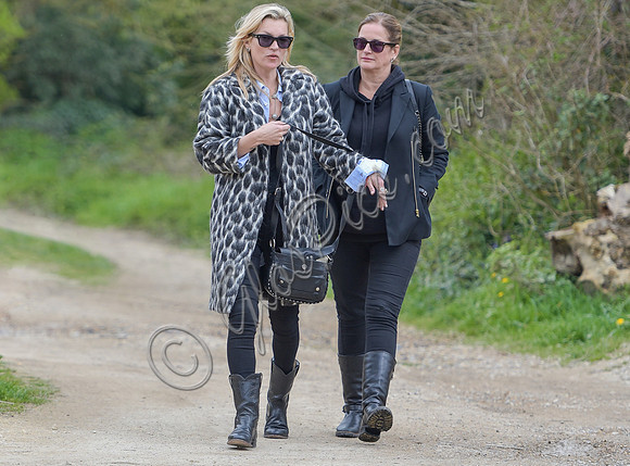 Kate Moss wearing Gucci mohair animal print overcoat with one other female