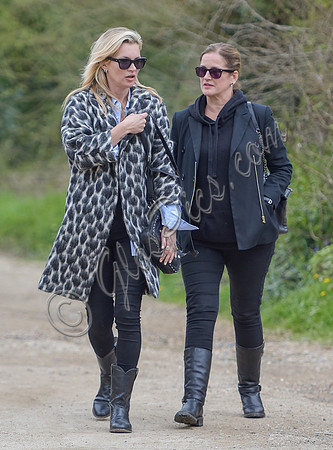 Kate Moss wearing Gucci mohair animal print overcoat with one other female