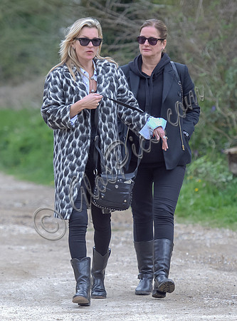 Kate Moss wearing Gucci mohair animal print overcoat with one other female