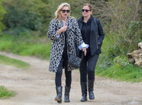 Kate Moss wearing Gucci mohair animal print overcoat with one other female