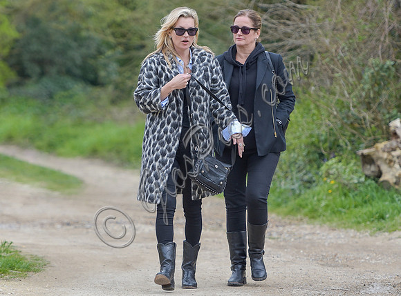Kate Moss wearing Gucci mohair animal print overcoat with one other female