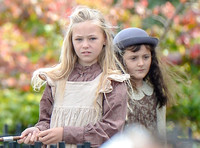 close up of a couple of school children in period costume