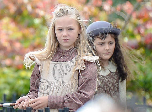 close up of a couple of school children in period costume
