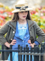 close up of Georgia Brinkworth as Phyll with hand on hips wearing straw hat