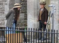 Young Loll and Phyll in the school yard behind railings