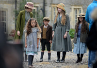 Young Loll with half-sisters and young Jo on way to school