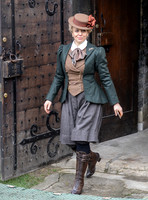 Amanda Abbington in period attire exiting Gloucester Cathedral