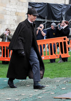Benedict Cumberbatch as Sherlock, wearing Inverness cape and deerstalker