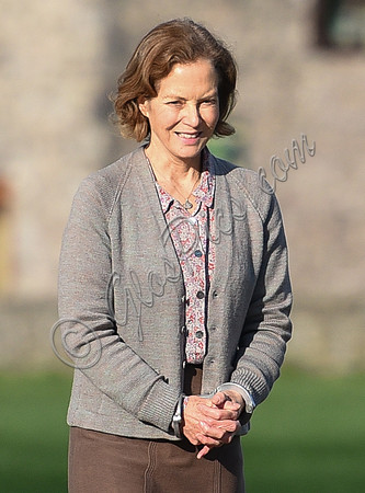 Jenny Seagrove in handcuffs wearing calf length skirt and thick woolly stockings