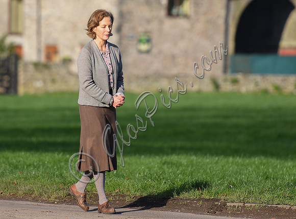 Jenny Seagrove in handcuffs wearing calf length skirt and thick woolly stockings