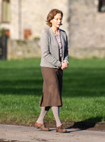 Jenny Seagrove in handcuffs wearing calf length skirt and thick woolly stockings