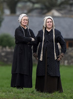 two women in period Jersey dress of the day