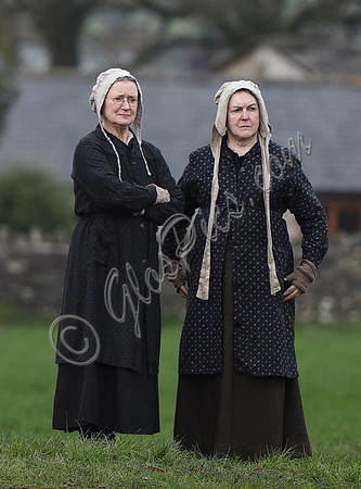 two women in period Jersey dress of the day