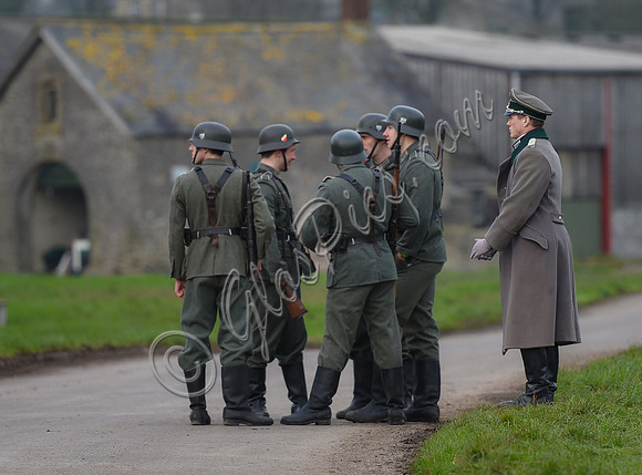 A group Nazi soldiers and an officer