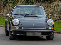 Kate Moss driving her black Porsche 911