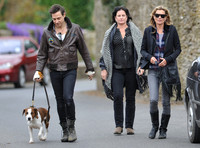 full length walking  towards camera, Jamie Hince with Archie on lead, Kate Moss and friend alongside.