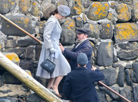 Lily James filming scenes from "Guernsey" at Clovelly Harbour