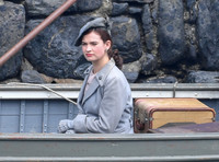 Lily James filming scenes from "Guernsey" at Clovelly Harbour