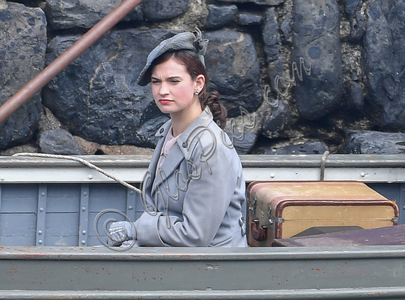 Lily James filming scenes from "Guernsey" at Clovelly Harbour