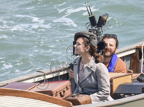 Lily James filming scenes from "Guernsey" at Clovelly Harbour