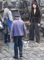 Lily James filming scenes from "Guernsey" at Clovelly Harbour