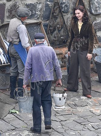 Lily James filming scenes from "Guernsey" at Clovelly Harbour