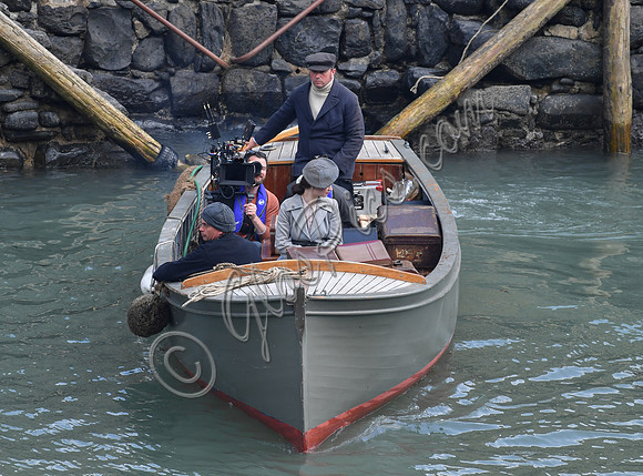 Lily James filming scenes from "Guernsey" at Clovelly Harbour
