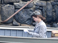 Lily James filming scenes from "Guernsey" at Clovelly Harbour