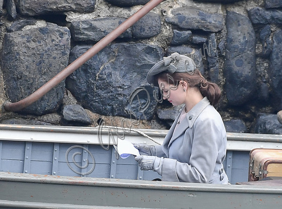 Lily James filming scenes from "Guernsey" at Clovelly Harbour