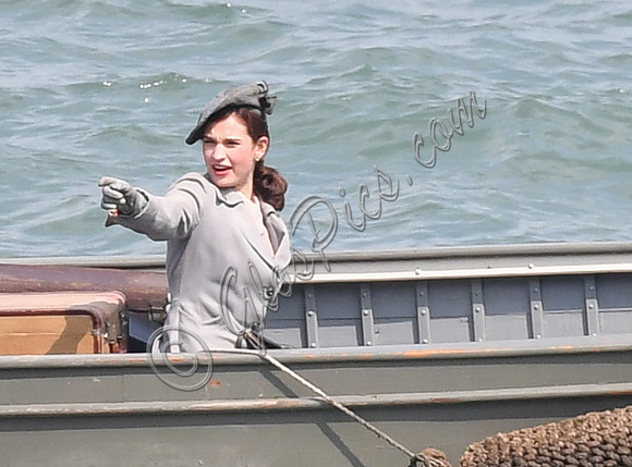 Lily James filming scenes from "Guernsey" at Clovelly Harbour